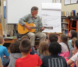 Jim Arnosky playing guitar